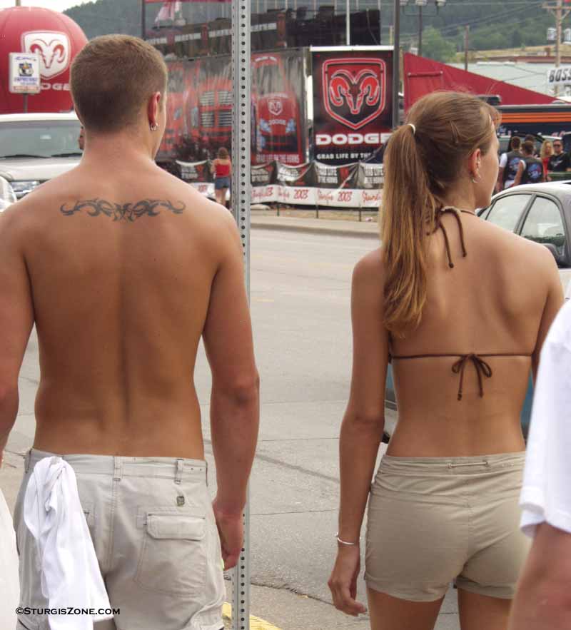 Plenty of tan skin to display an examples of rolling upper back tattoos