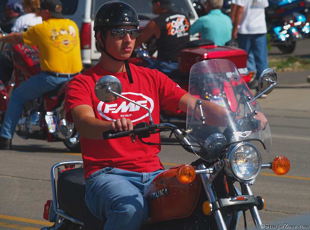 Man Riding Suzuki Motorcycle