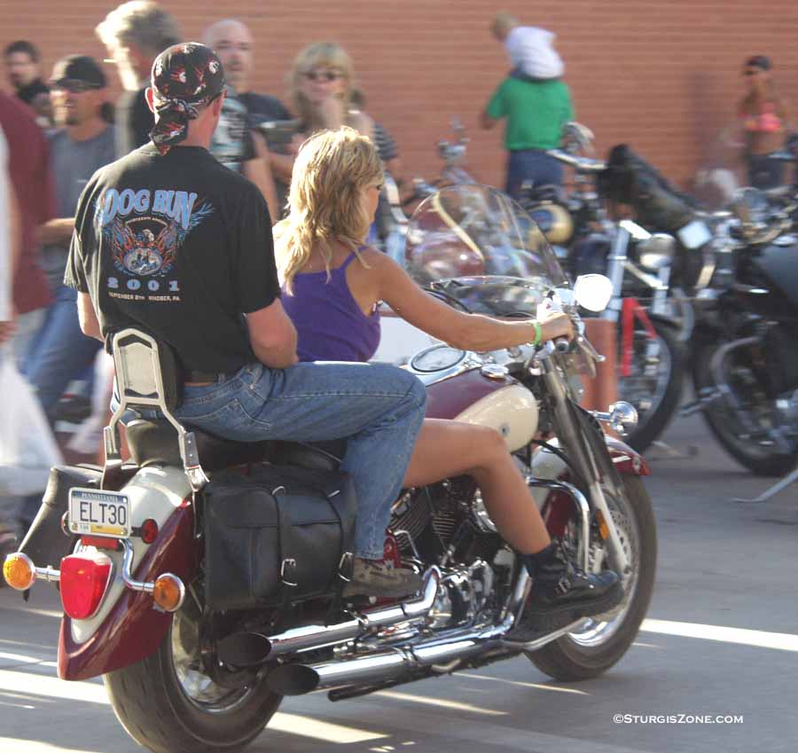 hitching a ride on a Harley