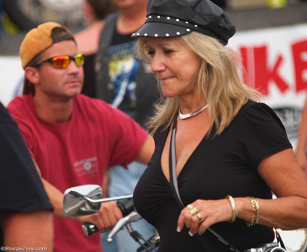 Woman in leather motorcycle cap